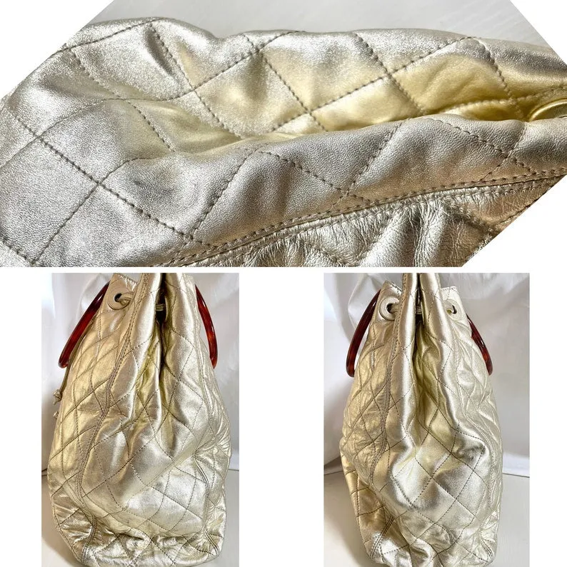 CHANEL Vintage campaign gold lamb leather hobo bucket bag with marble hoop handles and turn lock CC