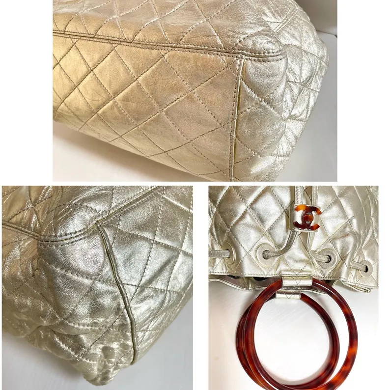 CHANEL Vintage campaign gold lamb leather hobo bucket bag with marble hoop handles and turn lock CC